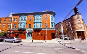 Exterior 256 Warren Street, Multi Colored building, Light blue trim, photo taken from street.